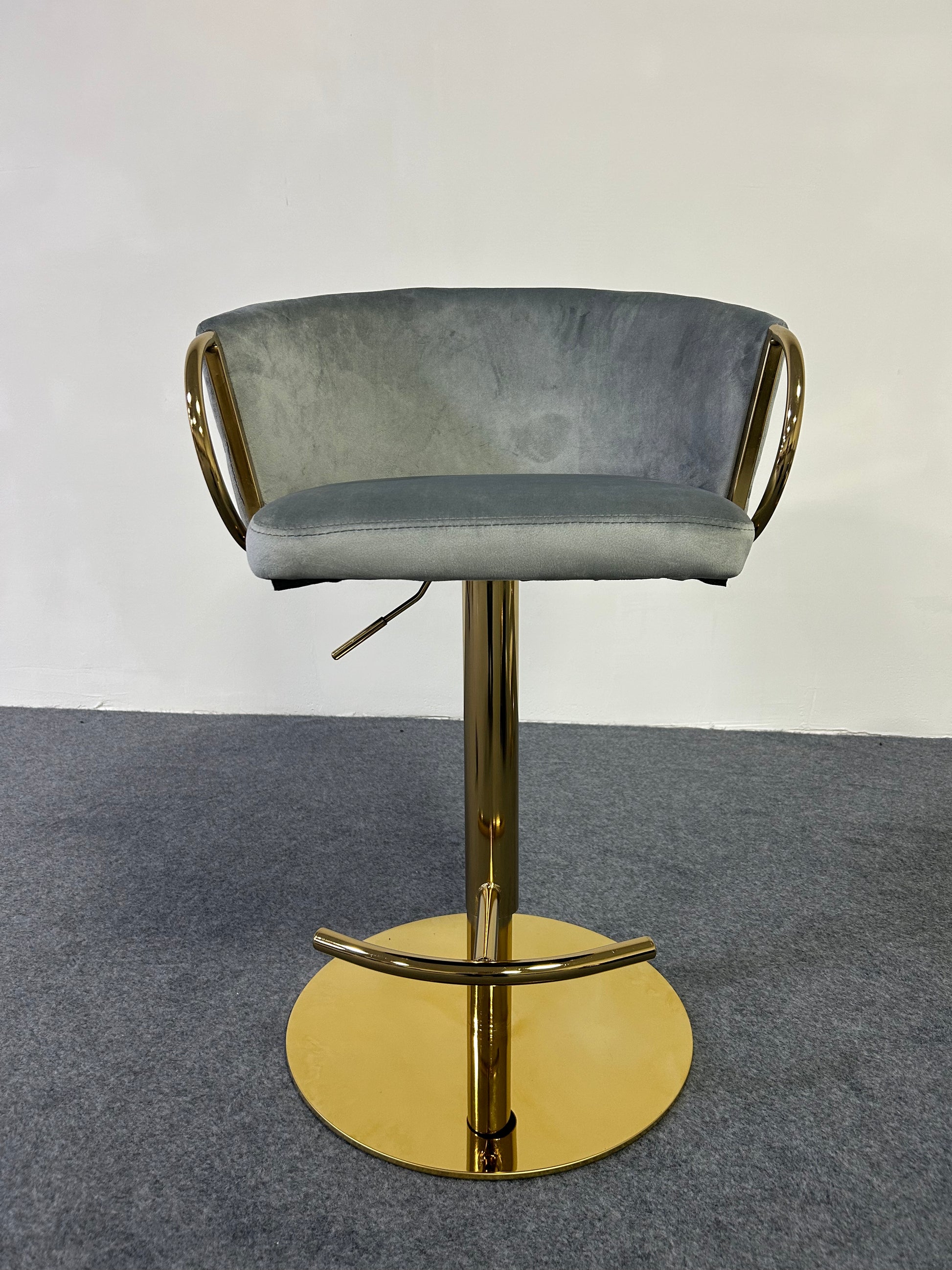 Modern Golden Barstool with a grey velvet seat and gold base, perfect for stylish interiors.