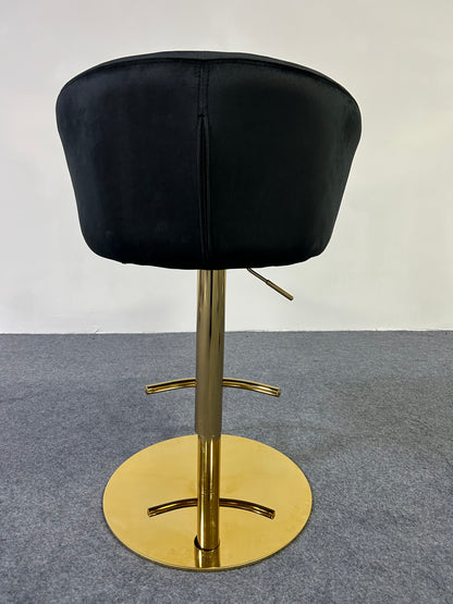 Back view of a sleek Modern Golden Barstool with a black velvet seat and shiny gold base.