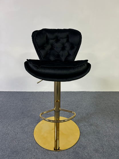 Luxury Golden Barstool featuring a sleek black tufted seat and a golden pedestal base, perfect for modern decor.