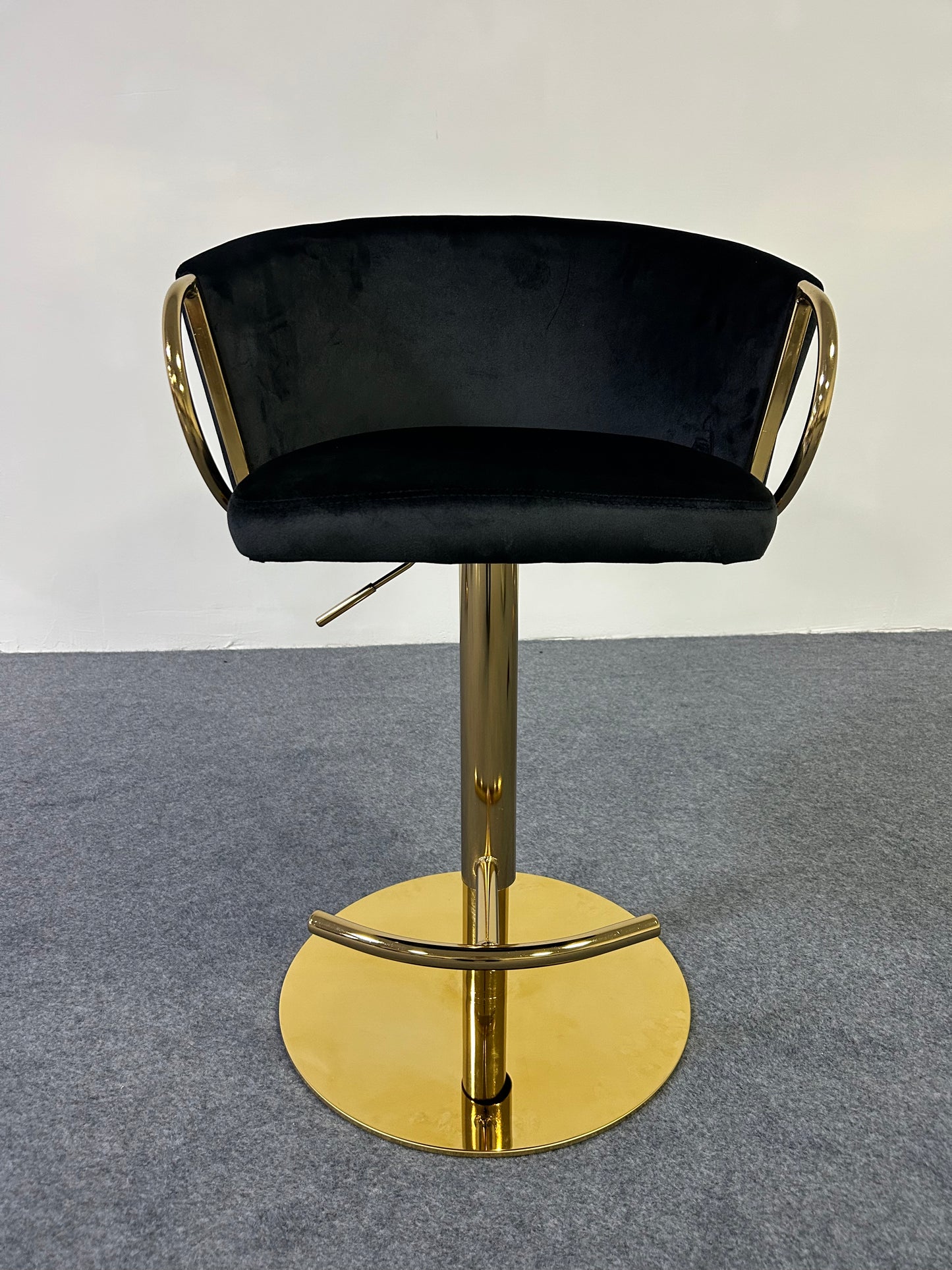 Modern Golden Barstool with black velvet seat and gold base, perfect for stylish interiors.