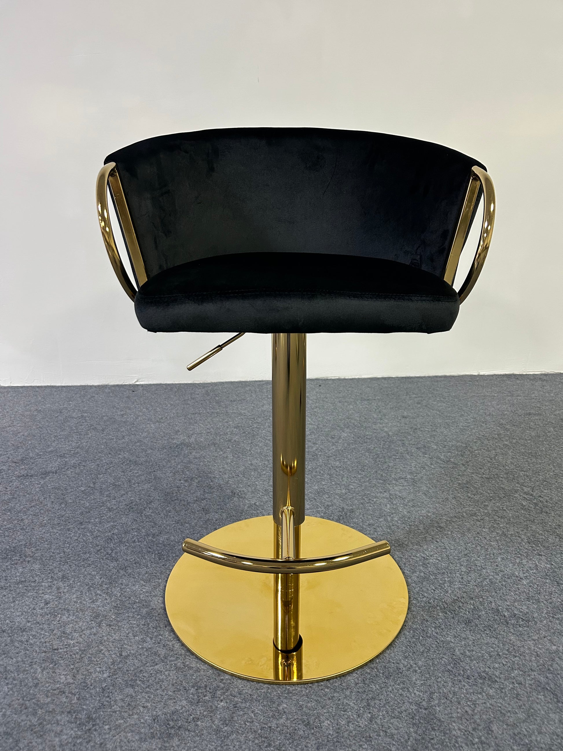 Modern Golden Barstool with black velvet seat and gold base, perfect for stylish interiors.