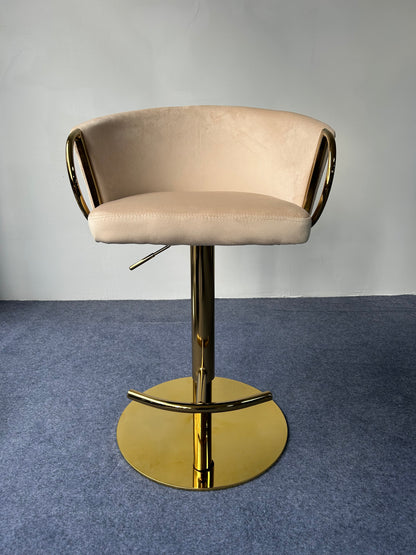 Modern Golden Barstool featuring a soft beige seat and shiny gold base, ideal for contemporary decor.