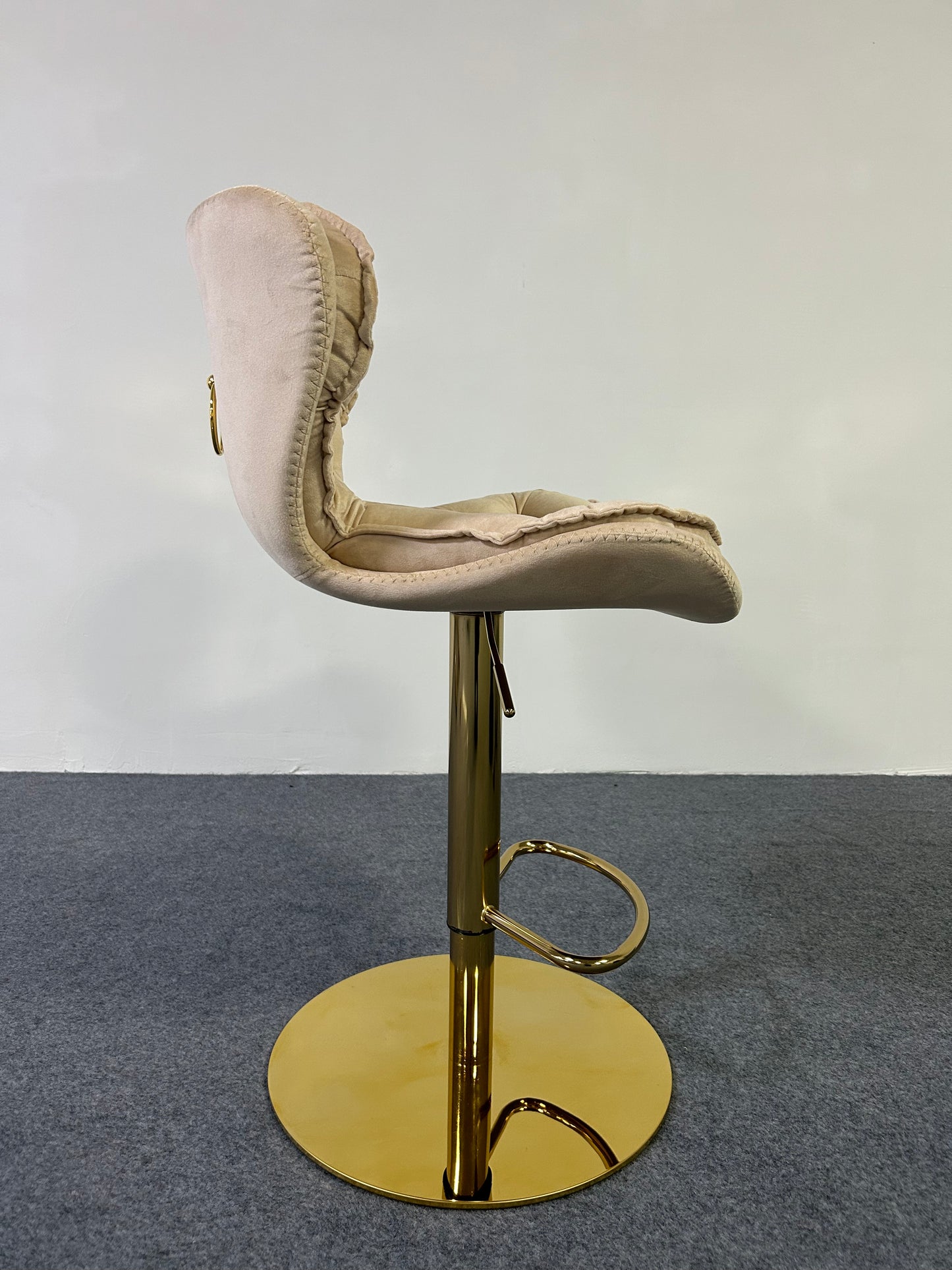 Luxury Golden Barstool with gold base and plush seat, ideal for modern interiors and stylish seating solutions.