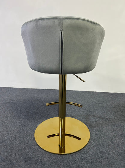 Modern Golden Barstool with gray upholstery and shiny gold base, perfect for contemporary interiors.