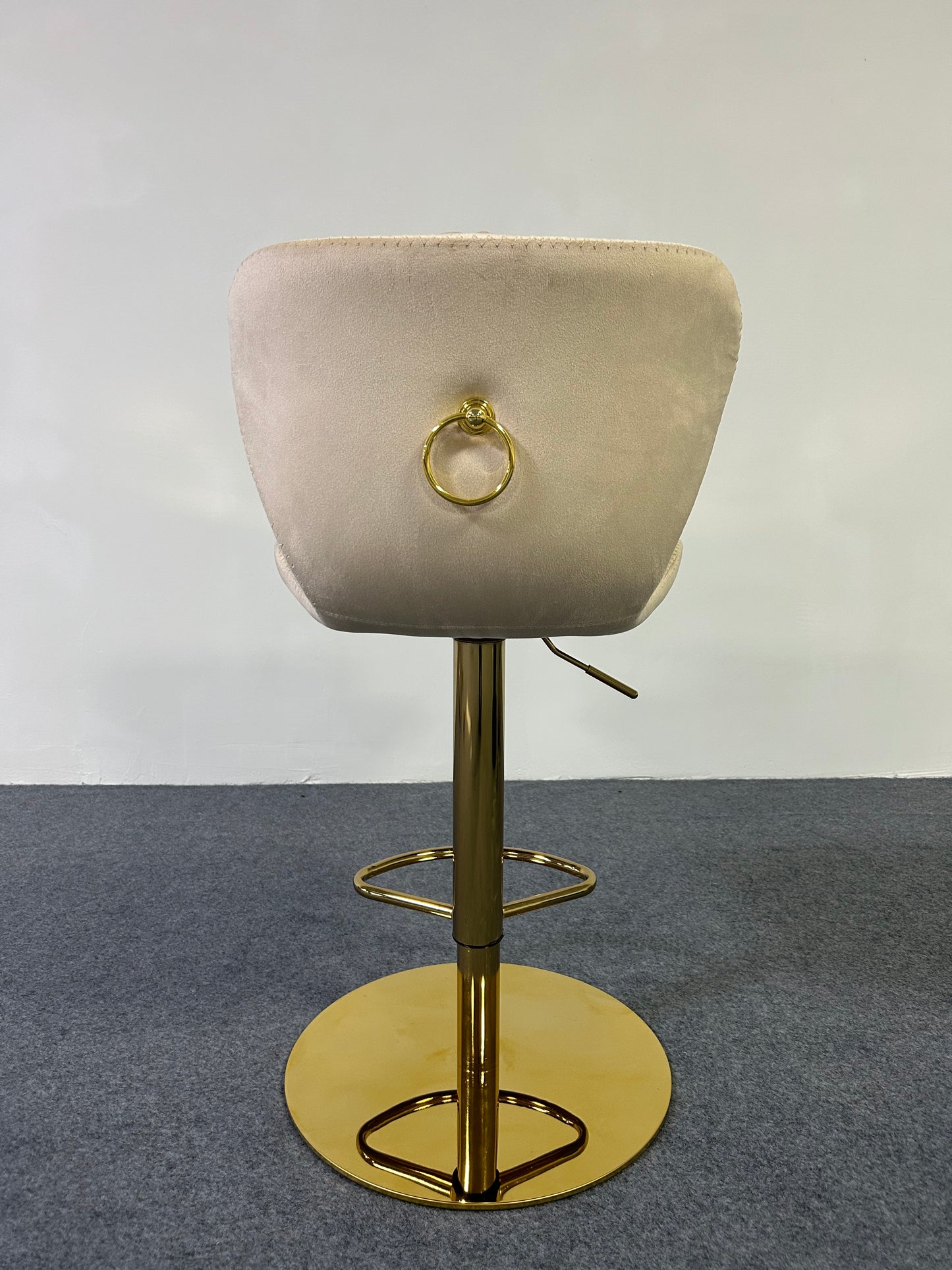 Luxury Golden Barstool with gold ring accent and adjustable height from a rear view, ideal for modern decor.