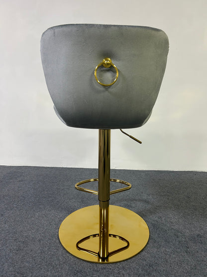 Luxury Golden Barstool with grey upholstery and gold accents, designed for style and comfort.
